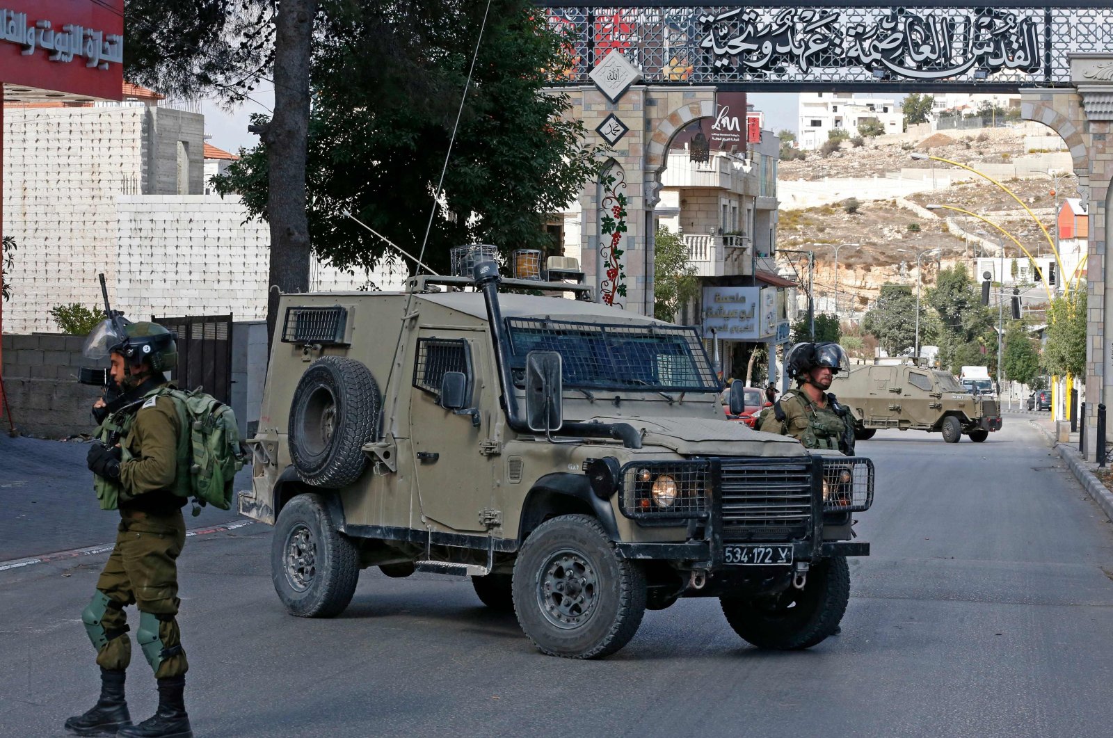 Israeli soldiers block a street following a demonstration calling for the release of Palestinian prisoners on hunger strike in Israeli jails, in the West Bank city of Hebron, occupied Palestine, Oct. 24, 2021. (AFP Photo)