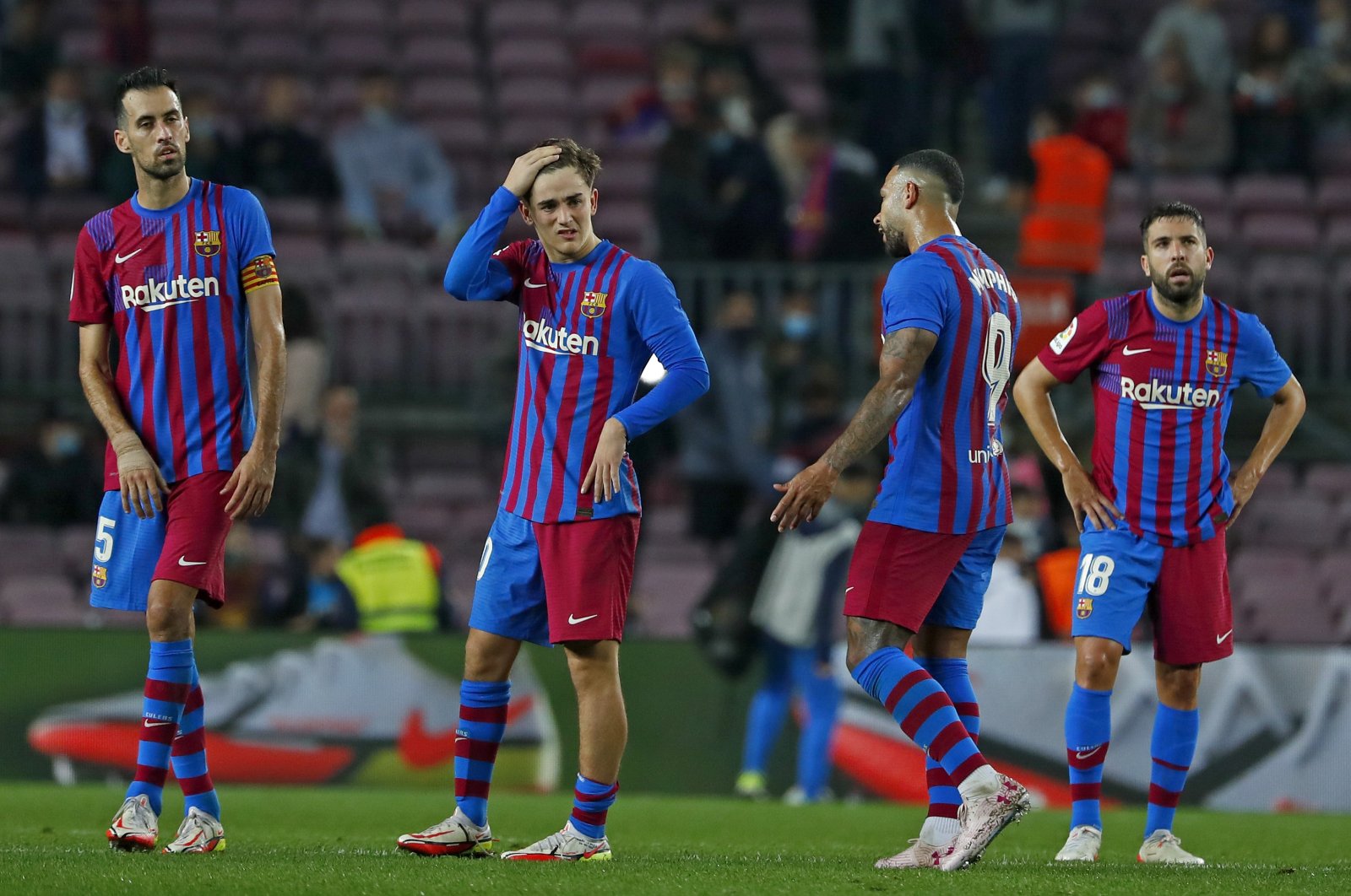 Barcelona players react after a La Liga match against Alaves at the Camp Nou in Barcelona, Spain, Oct. 30, 2021. (AP Photo)
