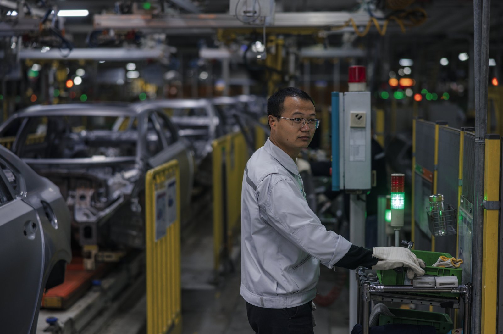A man works in the Kia Motors factory, during a media trip in Yancheng, Jiangsu province, China, Oct. 28, 2021. (EPA Photo)