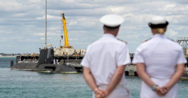 Australian navy personnel look at the U.K. nuclear-powered attack submarine HMS Astute docked at HMAS Stirling Royal Australian Navy base in Perth, Western Australia, Australia, Oct. 29, 2021. (EPA Photo)