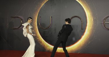 Zendaya (L) and Timothee Chalamet pose for photographers upon arrival at the premiere of the film "Dune," in London, U.K., Oct. 18, 2021. (AP Photo)