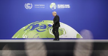 British Prime Minister Boris Johnson looks on as he prepares to receive attendees, at the COP26 U.N. Climate Summit in Glasgow, Scotland, Monday, Nov. 1, 2021. (Christopher Furlong/Pool via AP)