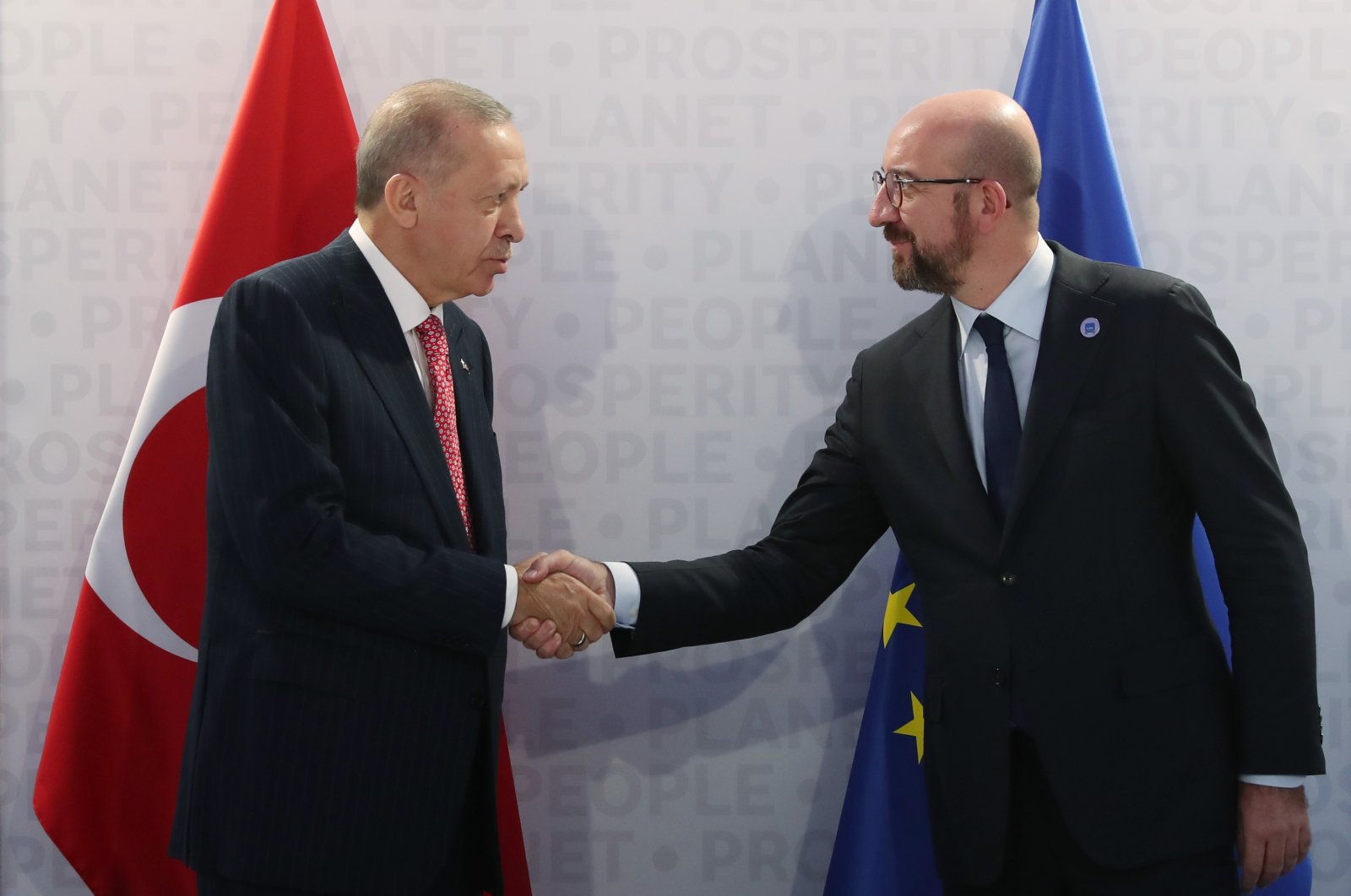 President Recep Tayyip Erdoğan shakes hands with European Council President Charles Michel at the G-20 summit in Rome, Italy, Oct. 31, 2021 (IHA Photo)