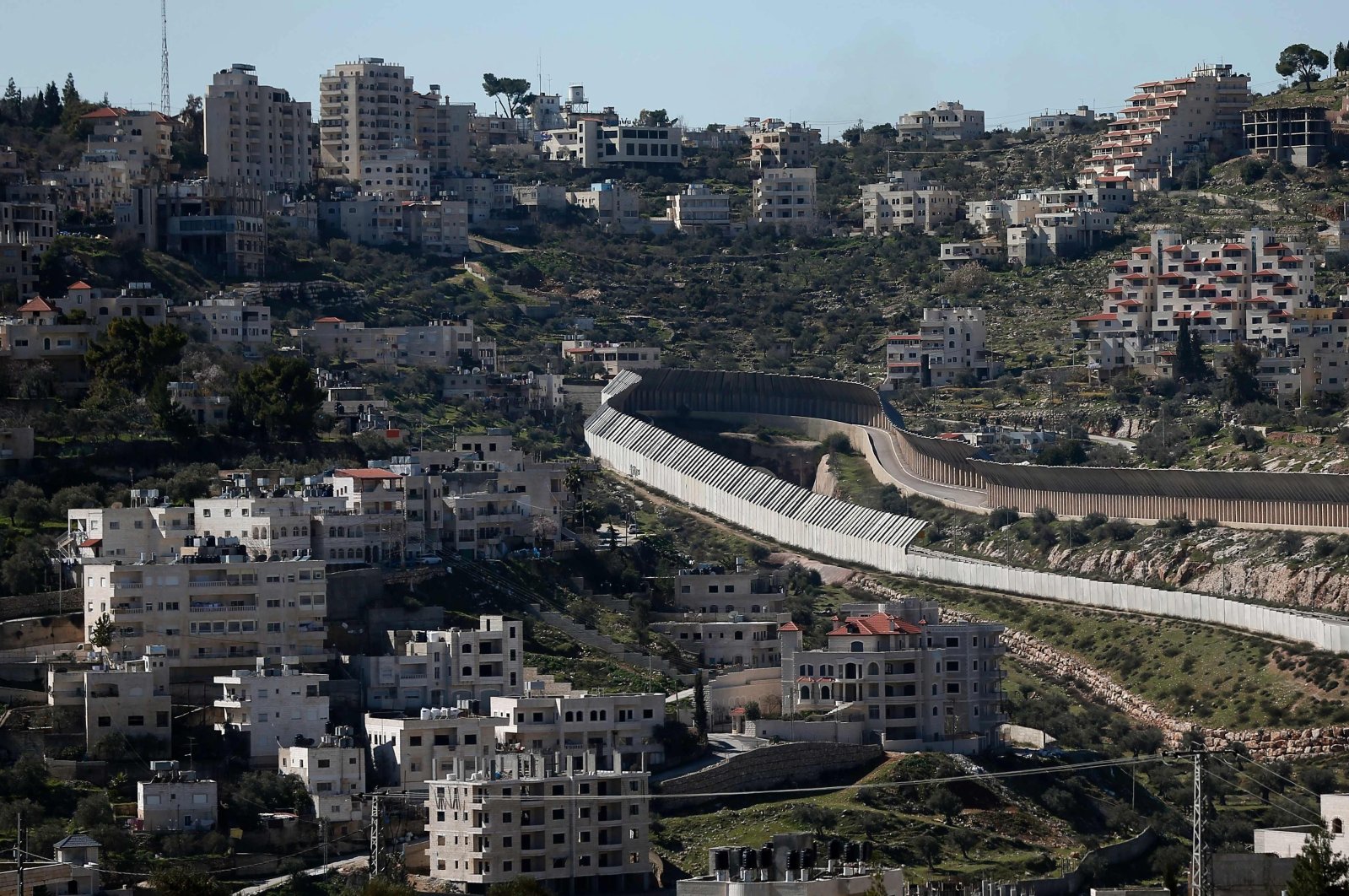 This picture taken from Jerusalem shows the protected road through the West Bank town of Bethlehem leading to the Israeli Gush Etzion settlement block and the West Bank city of Hebron, occupied Palestine, Feb. 12, 2016. (AFP Photo)