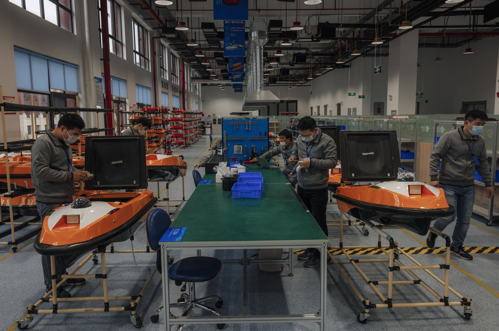 People work in Yunzhou factory for maritime autonomous boats, during a media trip in Yancheng, Jiangsu province, China, Oct. 28, 2021. (EPA Photo)