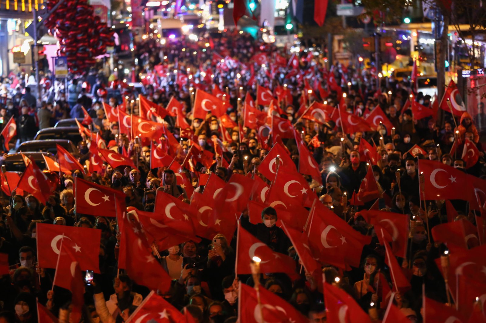 A crowd of people waving Turkish flags shouting slogans during the 98th-anniversary celebrations of Republic Day, Istanbul, Turkey, Oct. 29, 2021. (Photo by Getty Images)
