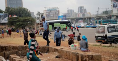 Police officers walk amongst civilians at Meskel Square in Addis Ababa, Ethiopia, Feb. 21, 2018. (Reuters Photo)