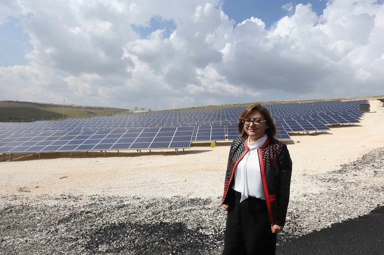 Gaziantep Mayor Fatma Şahin poses in front of a solar power plant in Gaziantep, southeastern Turkey, Nov. 2, 2021. (IHA Photo)