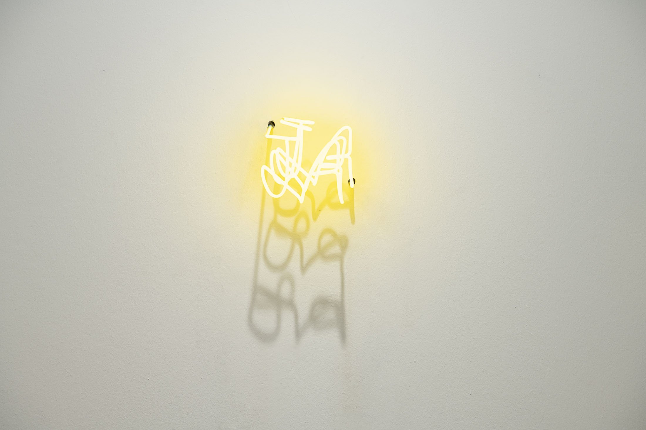 Ardan Özmenoğlu, 'JA,' 2021, yellow neon tubing and transformator, 19 by 16 by 25 centimeters. (Photo Courtesy of Anna Laudel)