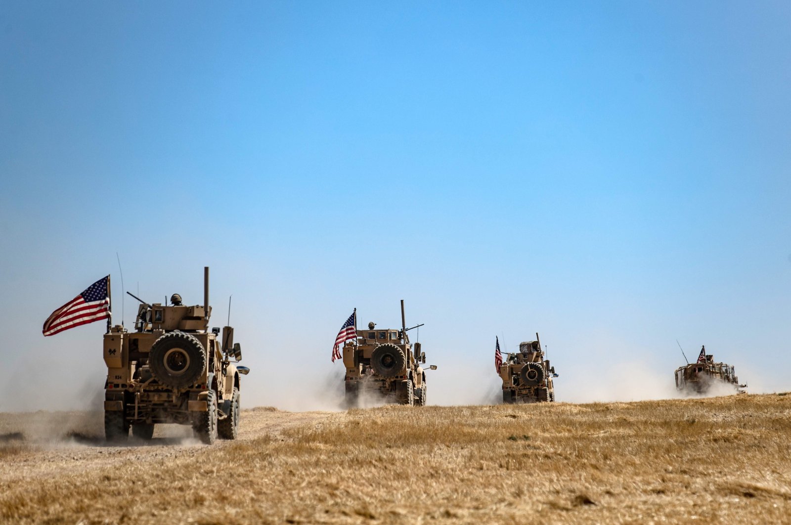 A U.S. military convoy takes part in a joint patrol with Turkish troops in the village of al-Hashisha on the outskirts of Tal Abyad, Syria, Sept. 8, 2019. (AFP Photo)