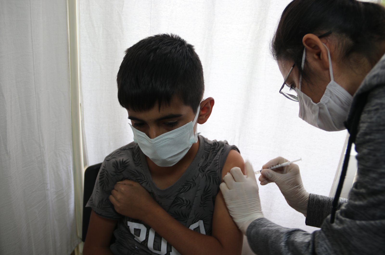 A boy receives a vaccine in southeastern Şanlıurfa province, Turkey, Nov. 3, 2021. (AA Photo)