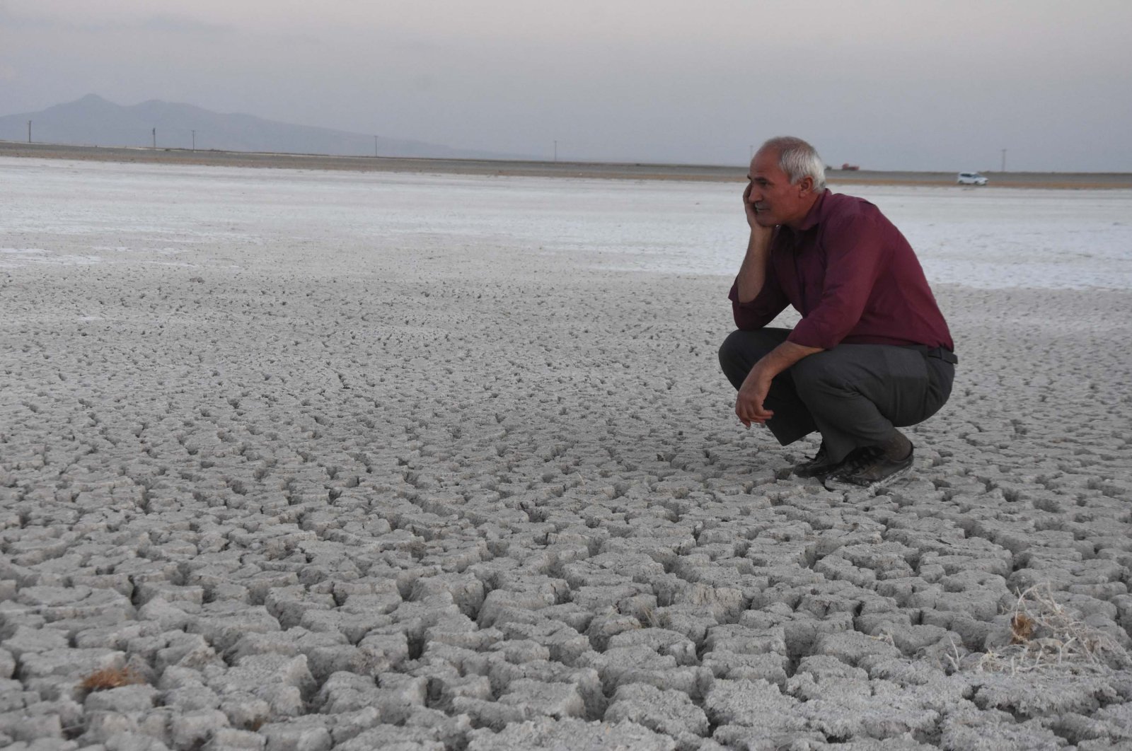 A man seen looking at a dried up Lake Arın, in Bitlis Province, eastern Turkey, Oct. 18, 2021. (DHA Photo)