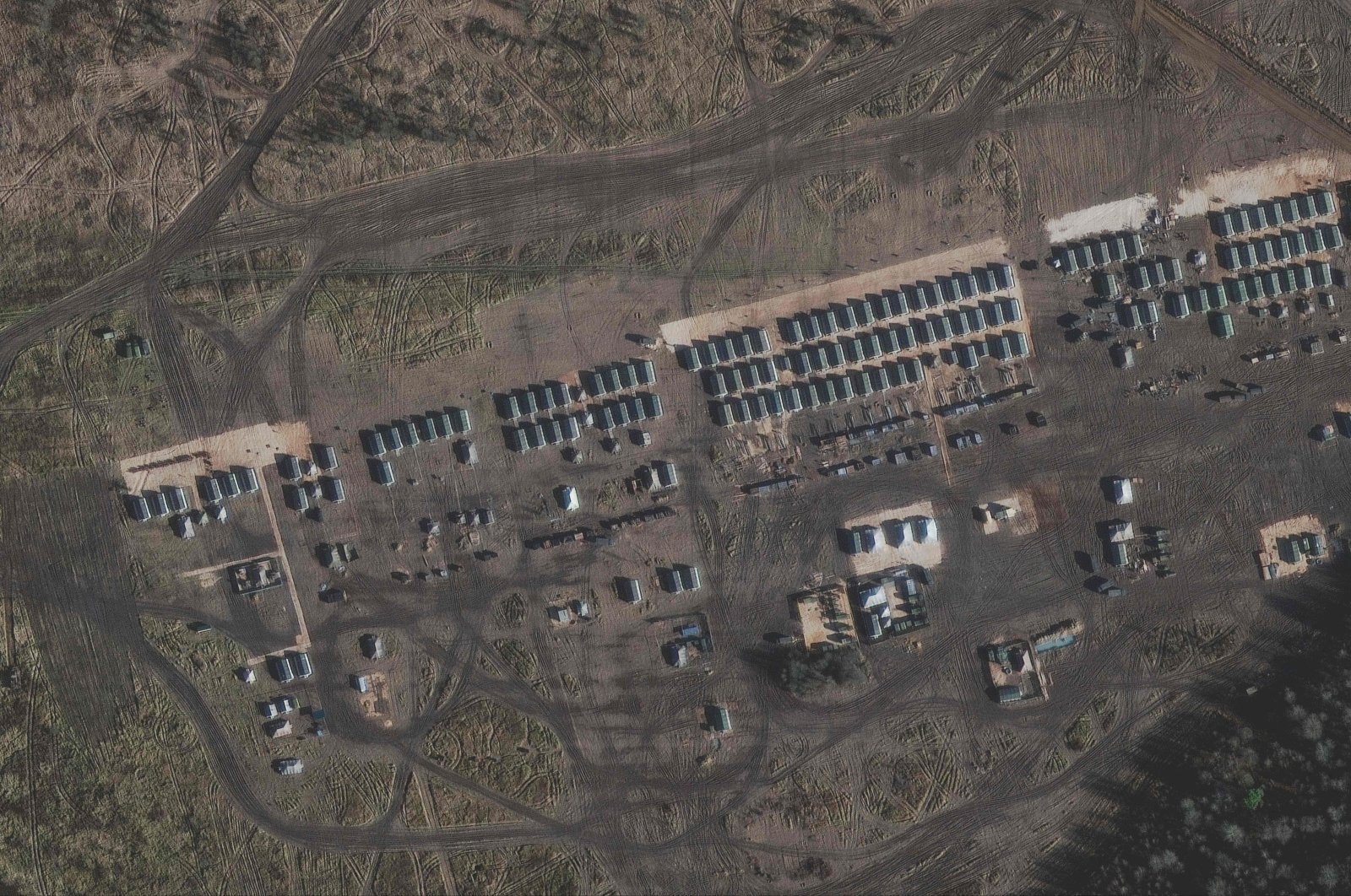This handout satellite image released by Maxar Technologies and taken on Nov. 1, 2021, shows troop tents and an administrative area amid the presence of a large number of ground forces deployed on the northern edge of the town of Yelnya, Smolensk Oblast, Russia. (Satellite image ©2021 Maxar Technologies / AFP)