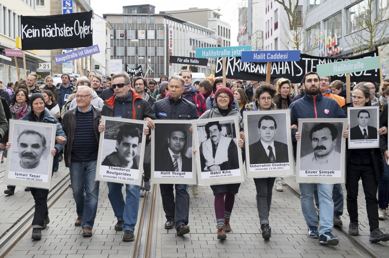 Participants of the demonstration "Kein Naechstes Opfer!" ("No other victim!") walk through the inner city of Kassel, Germany, April 6, 2017. (AP Photo)