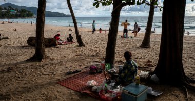 People enjoy the beach as Phuket opens for foreigners, who are fully vaccinated against the coronavirus, to visit the resort island without quarantine, in Phuket, Thailand, Sept. 19, 2021. (Reuters Photo)