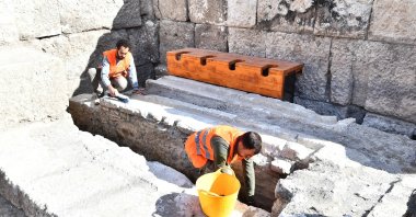 Archaeologists work in the area of the latrina in ancient city of Smyrna, Izmir, western Turkey, Nov. 3, 2021. (AA Photo)