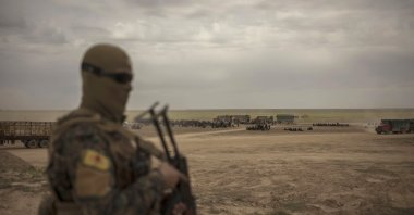 A YPG terrorist seen outside Baghouz, Syria. (AP File Photo)