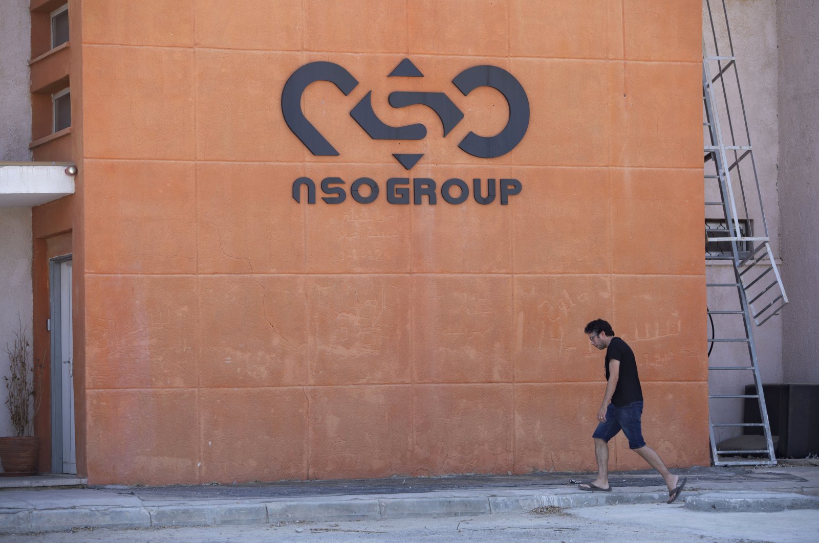 A logo adorns a wall on a branch of the Israeli NSO Group company, near the southern Israeli town of Sapir, Aug. 24, 2021. (AP Photo)
