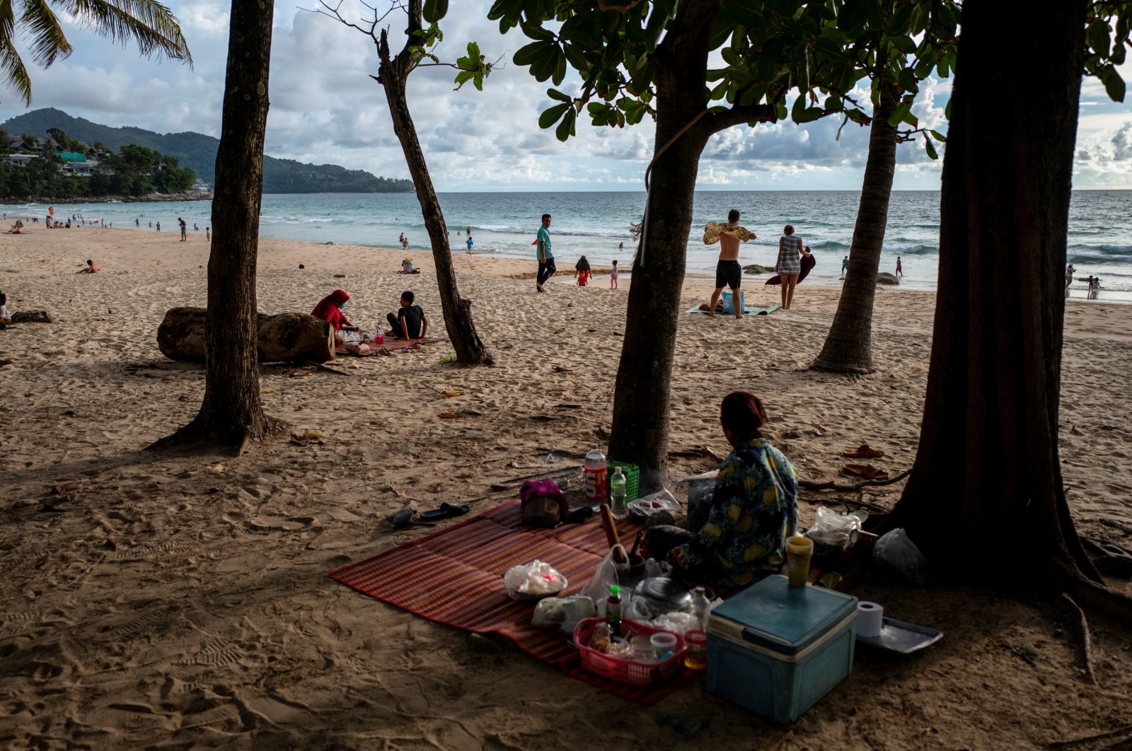 People enjoy the beach as Phuket opens for foreigners, who are fully vaccinated against the coronavirus, to visit the resort island without quarantine, in Phuket, Thailand, Sept. 19, 2021. (Reuters Photo)