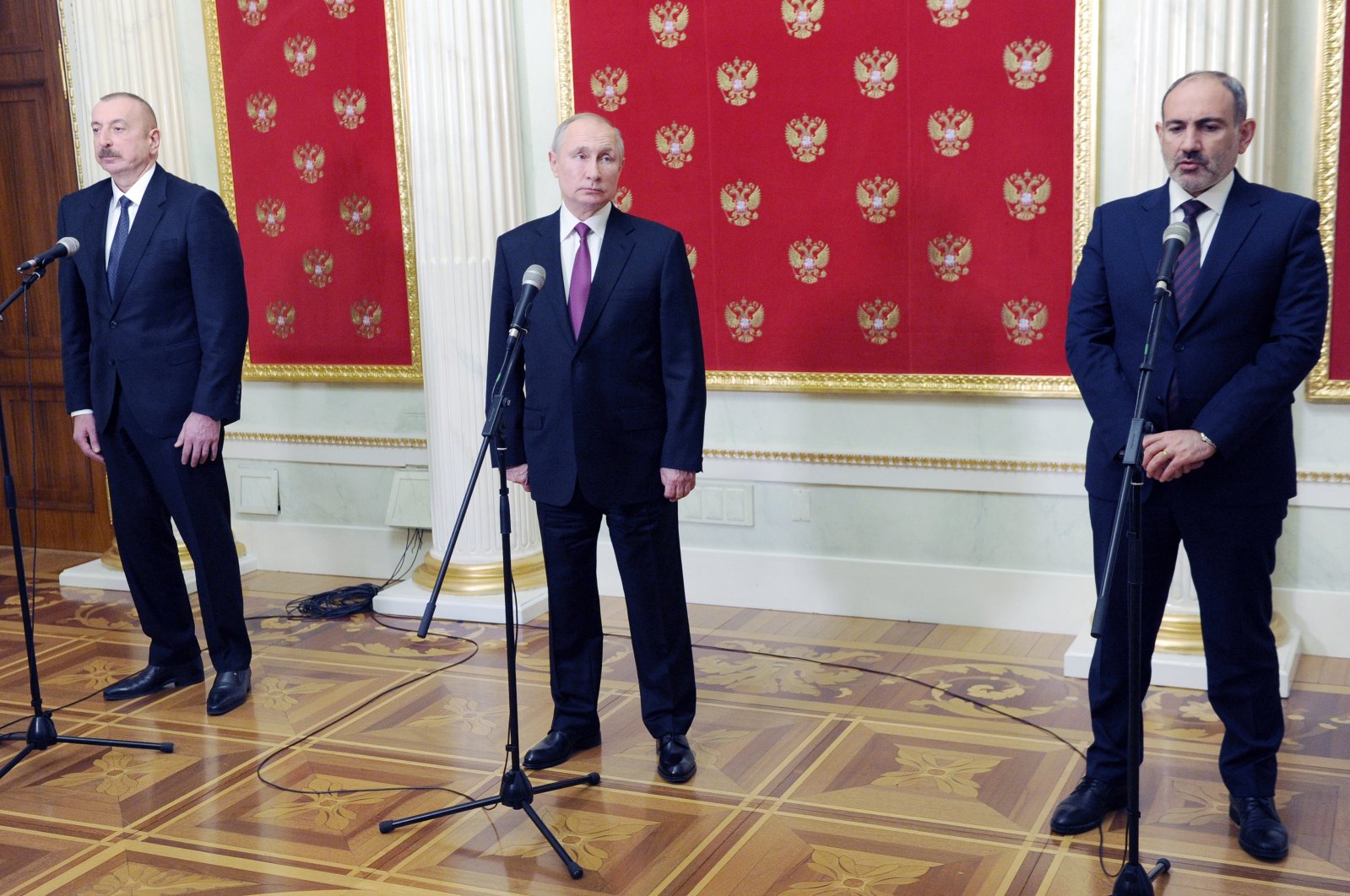 Russian President Vladimir Putin (C), Azerbaijan's President Ilham Aliyev (L) and Armenian Prime Minister Nikol Pashinyan (R) speak to media after talks at the Kremlin in Moscow, Russia, Jan. 11, 2021. (AP Photo)