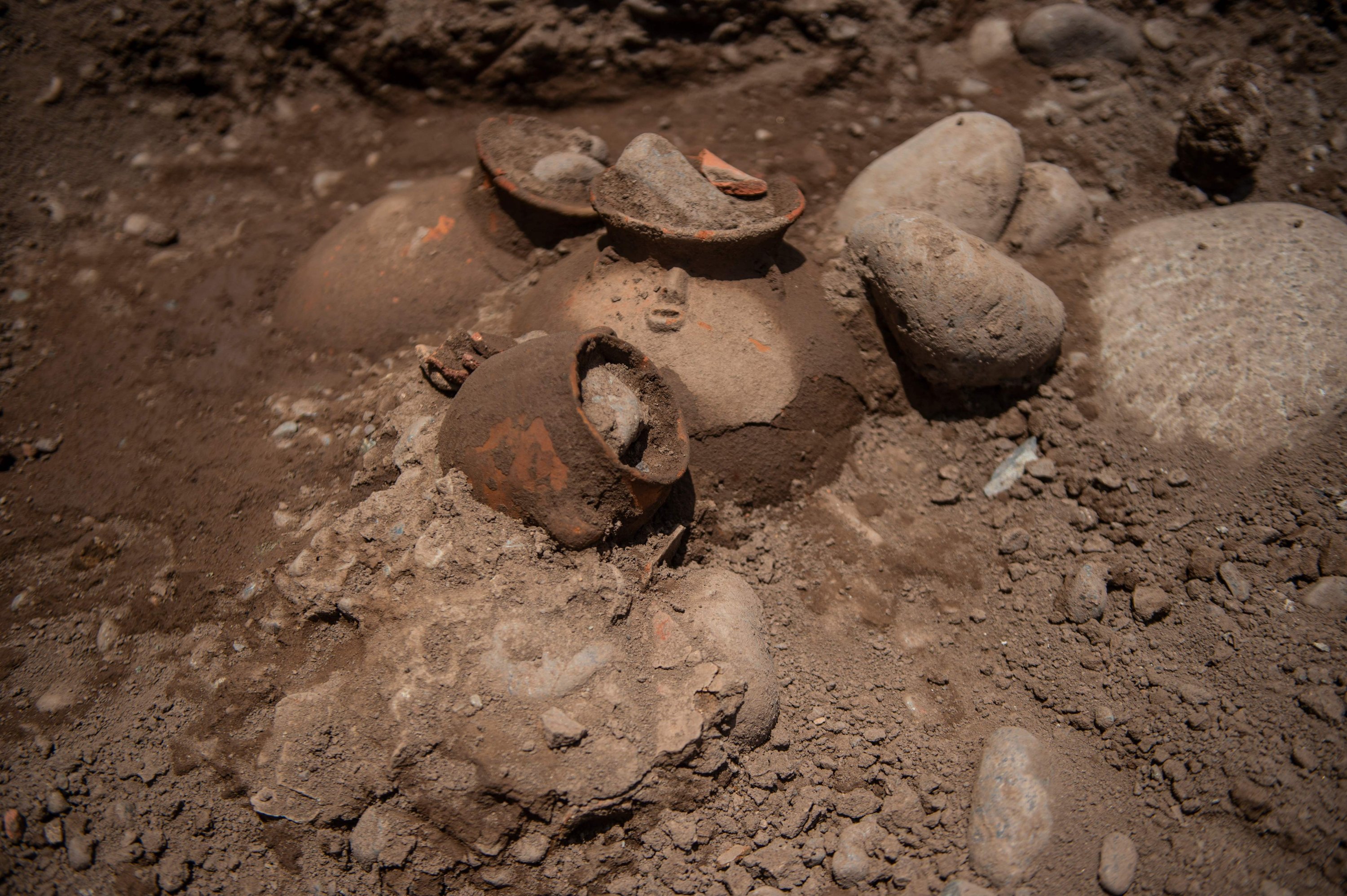 View of ancient vessels found by a crew laying a natural gas pipe under a street in Lima, Peru, Nov. 4, 2021. (AFP Photo)