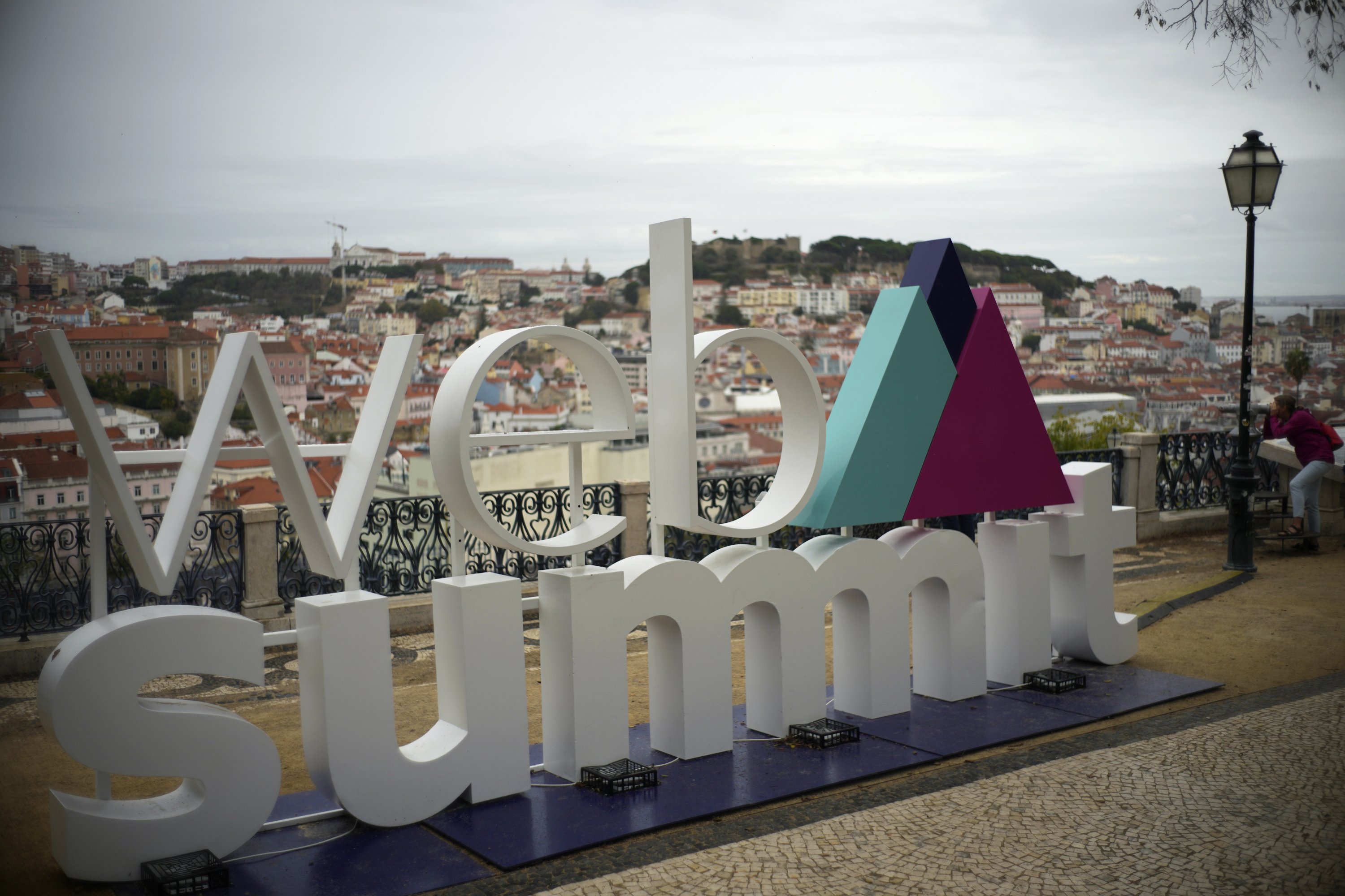The logo of the Web Summit technology conference is displayed at a viewpoint overlooking downtown Lisbon, Portugal, Oct. 29, 2021. (AP Photo)
