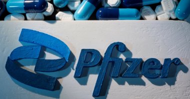A 3D printed Pfizer logo is placed near medicines from the same manufacturer in this illustration taken Sept. 29, 2021. (Reuters Phoot)