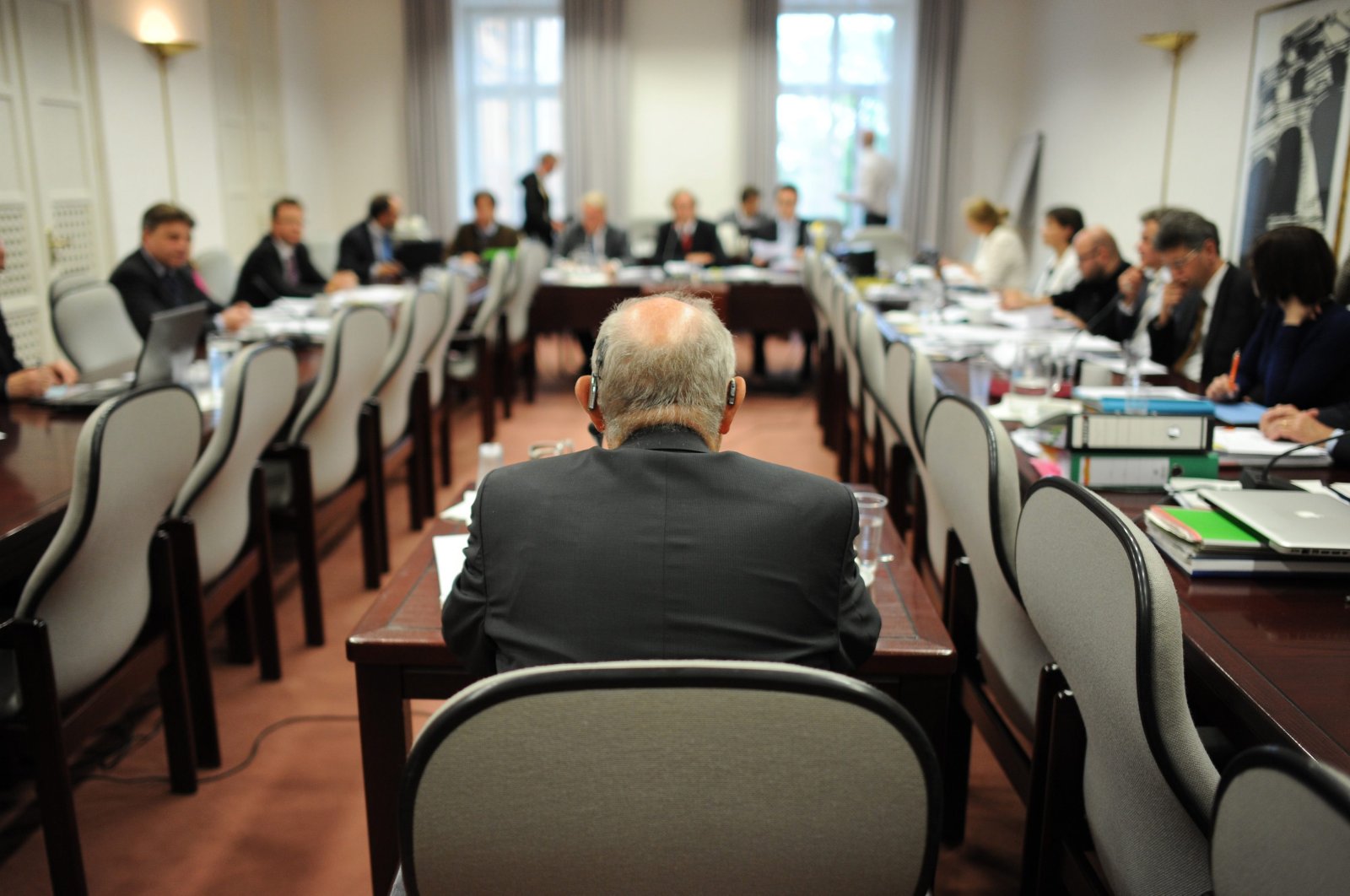 Former Premier of Bavaria Gunther Beckstein (back to camera) sits at a table to testify as a witness in the hearing of the NSU inquiry commission at the Bavarian state parliament in Munich, Germany, June 11, 2013. (EPA Photo)
