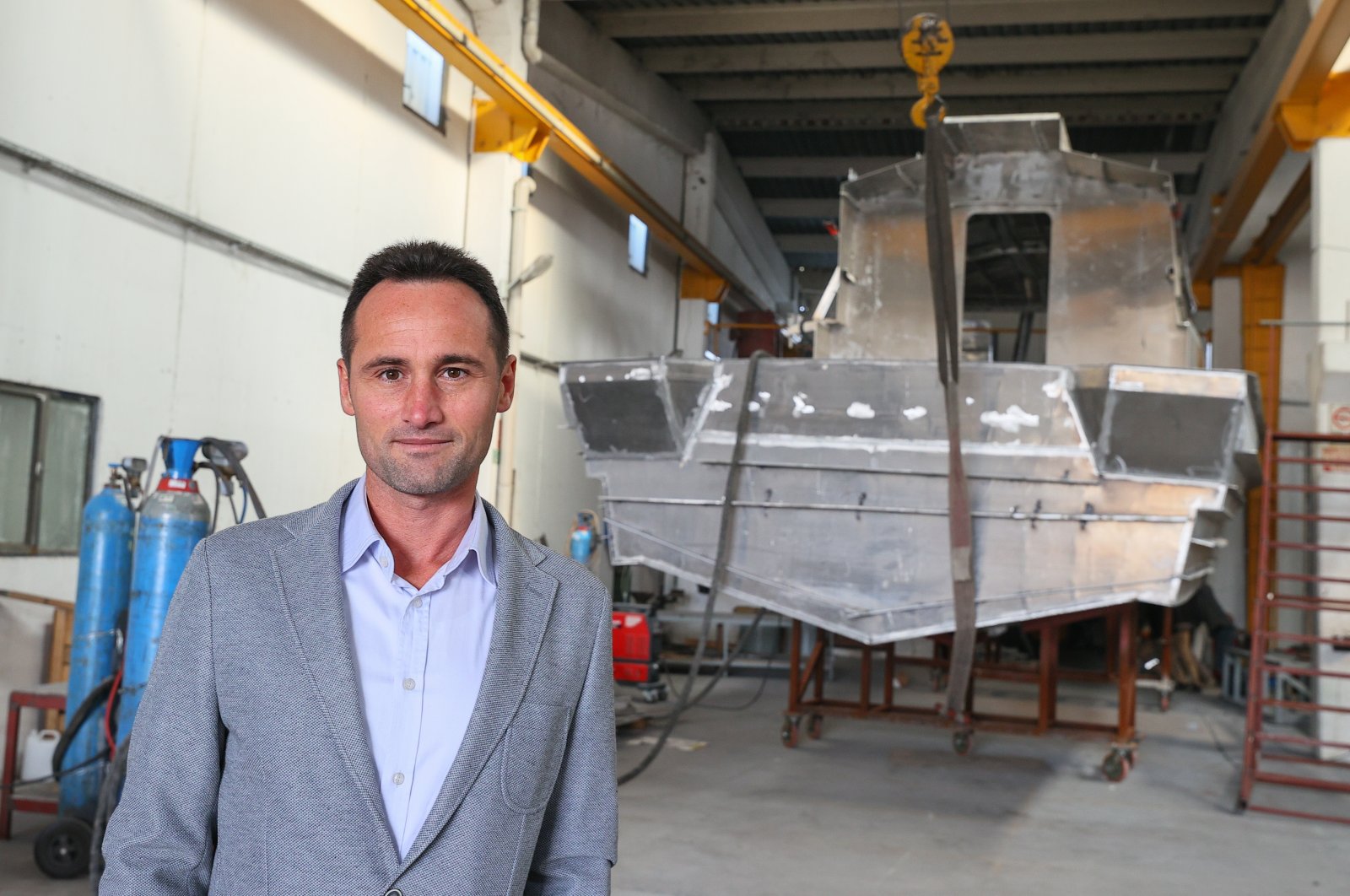 Gözüyılmaz Mühendislik and Izmir Shipyard Deputy General Manager Özgür Inam at the company facility, Izmir, western Turkey, Nov. 5, 2021. (AA Photo)