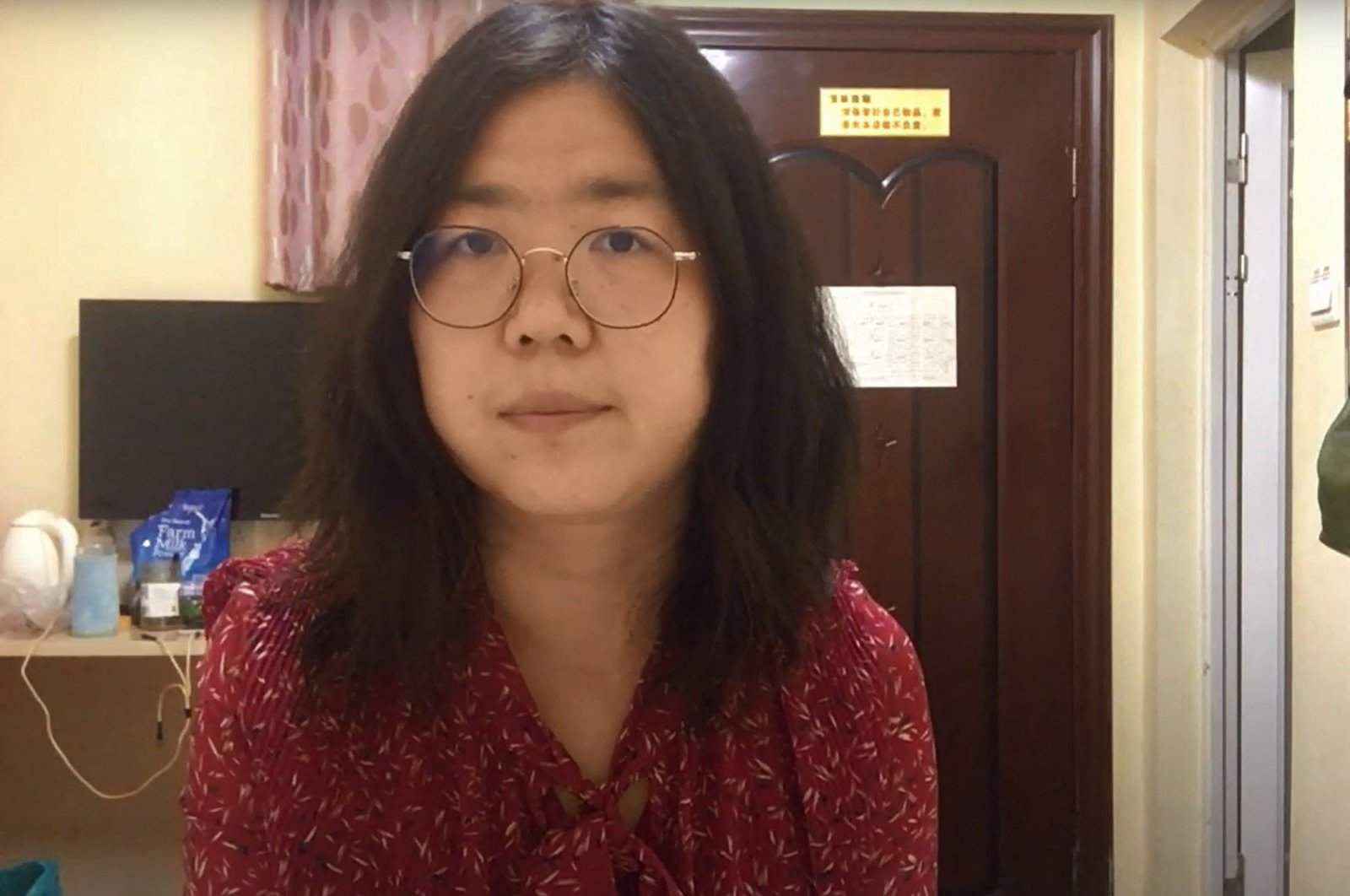This file screengrab taken on Dec. 28, 2020, from an undated video showing former Chinese lawyer and citizen journalist Zhang Zhan as she broadcasts via YouTube, at an unconfirmed location in China. (Youtube via AFP)