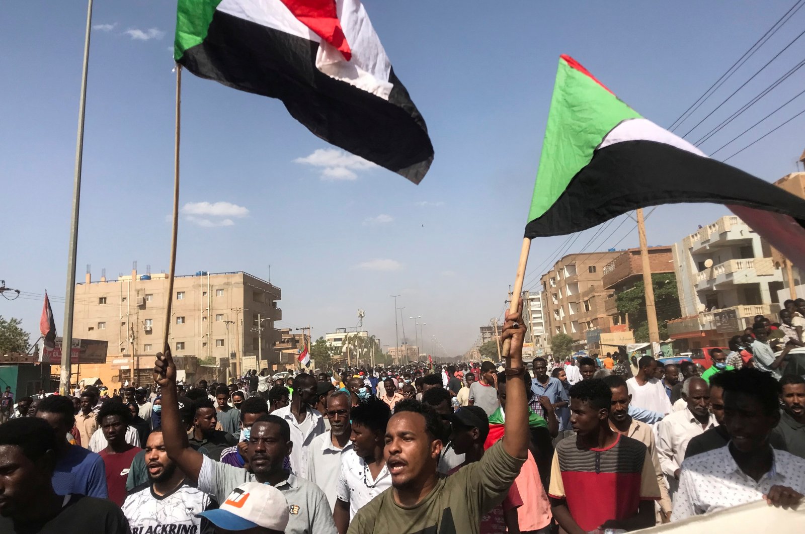 Protesters hold flags and chant slogans as they march against the Sudanese military's recent seizure of power and ousting of the civilian government, in the capital Khartoum, Sudan, Oct. 30, 2021. (Reuters Photo)