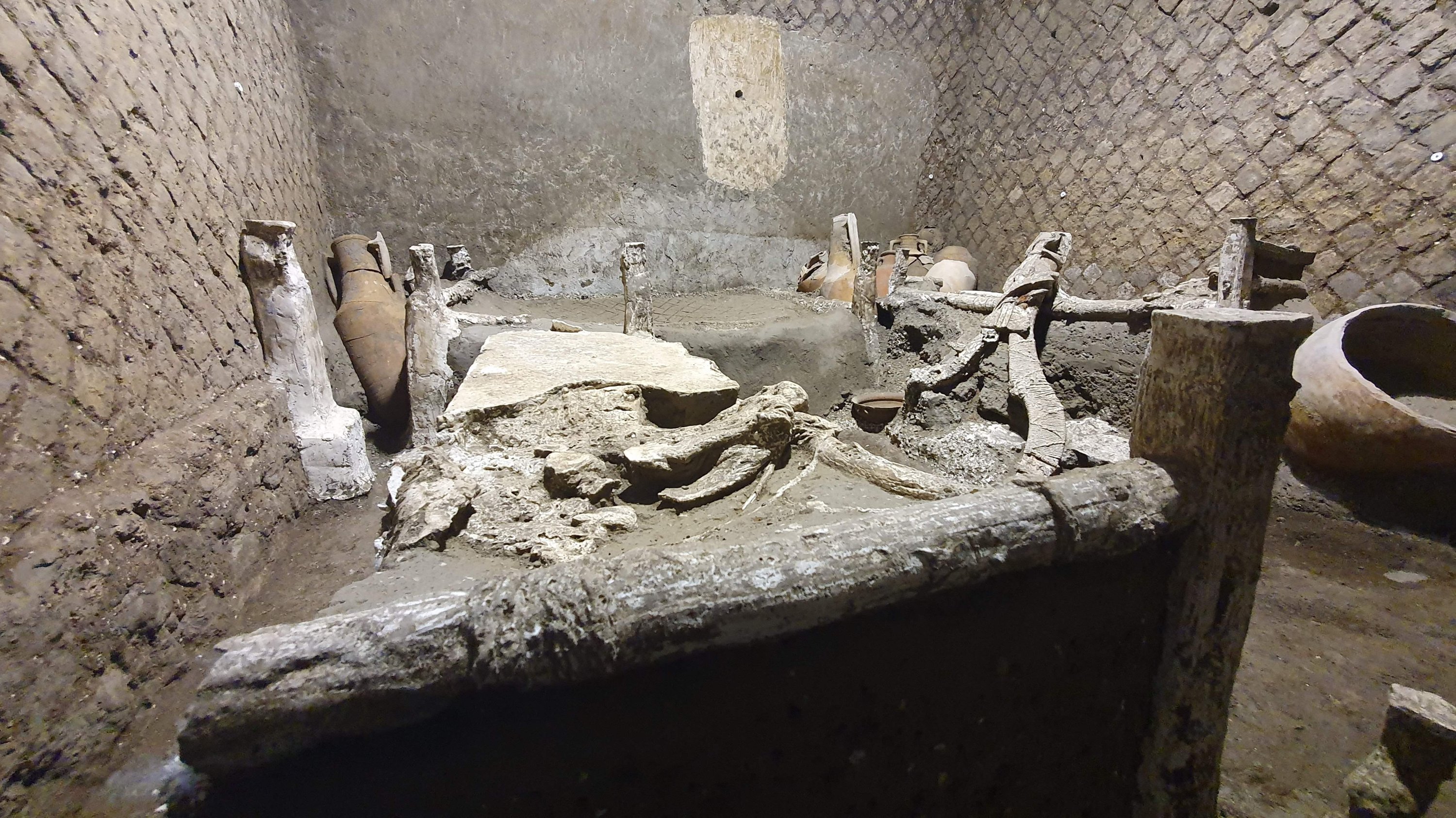 A photo handout on November 6, 2021, by the Pompeii Archaeological Park shows "The room of Slaves," an exceptionally well-preserved room for the slaves who worked in Villa Civita Giuliana in Pompeii, a villa where a ceremonial chariot and a stable with a harnessed horses were earlier unearthed. (POMPEI ARCHAEOLOGICAL PARK via AFP Photo)