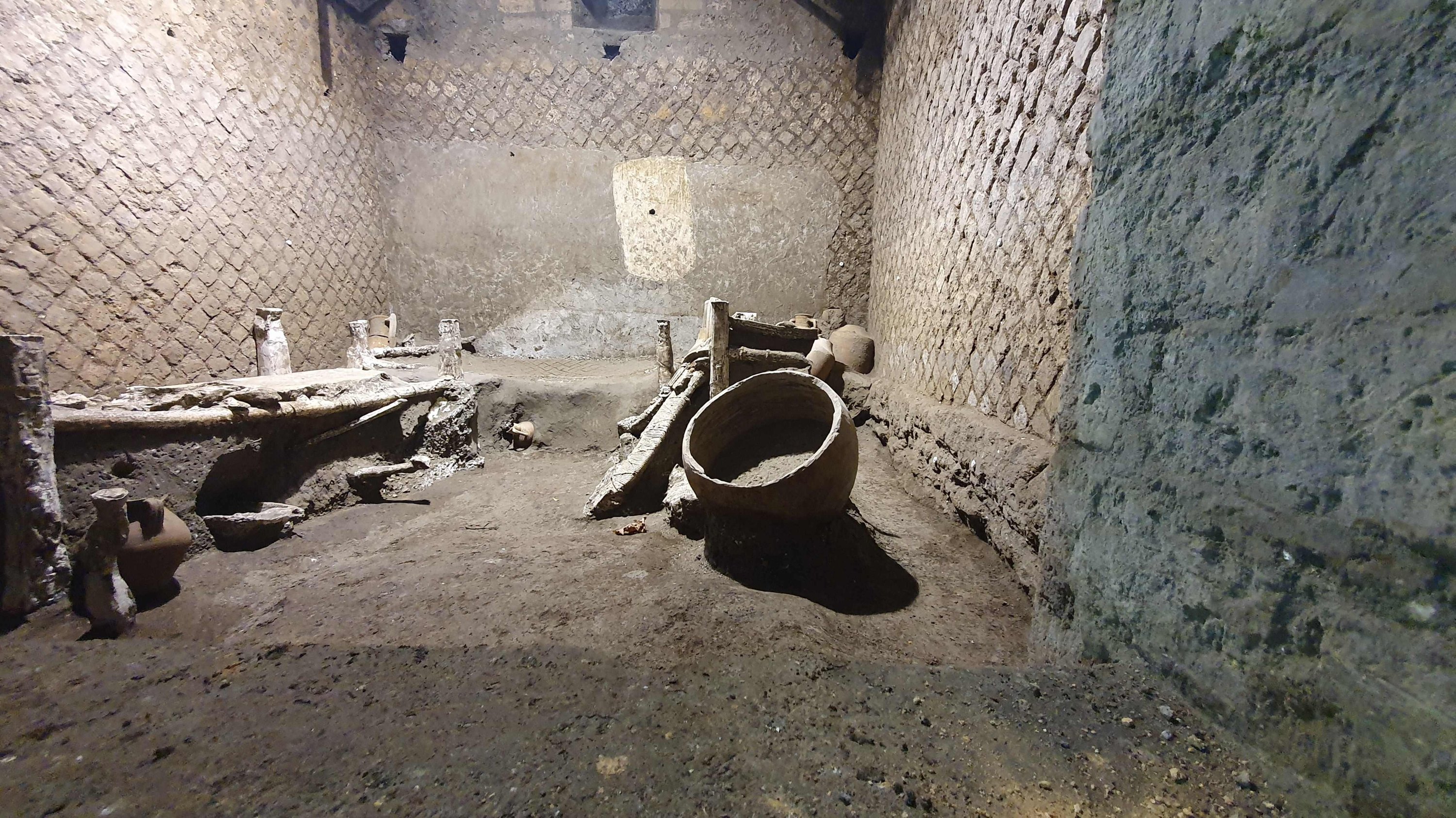 A photo handout on November 6, 2021, by the Pompeii Archaeological Park shows 'The room of Slaves,' an exceptionally well-preserved room for the slaves who worked in Villa Civita Giuliana in Pompeii, a villa where a ceremonial chariot and a stable with a harnessed horses were earlier unearthed. (POMPEI ARCHAEOLOGICAL PARK via AFP Photo)
