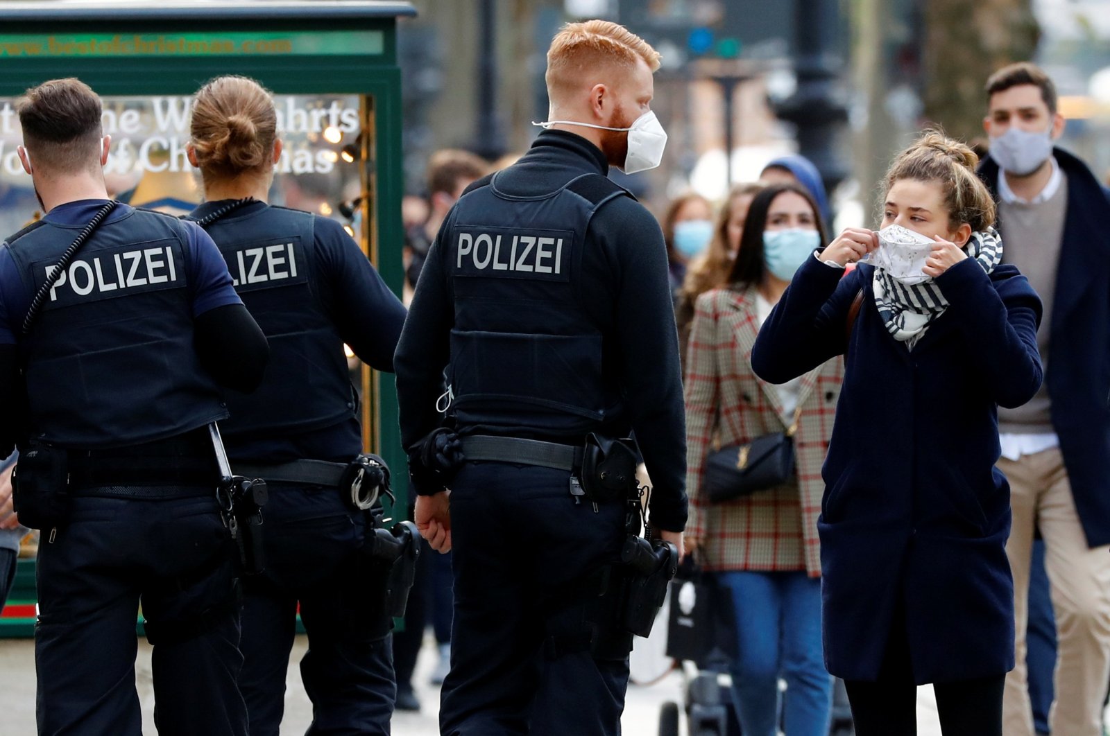 Police officers check that people are wearing face masks on Kurfuerstendamm boulevard amid the COVID-19 outbreak, Berlin, Germany, Oct. 24, 2020. (Reuters Photo)