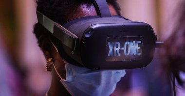 An attendee uses a virtual-reality (VR) headset during the Web Summit in Lisbon, Portugal, Nov. 2, 2021. (AFP Photo)