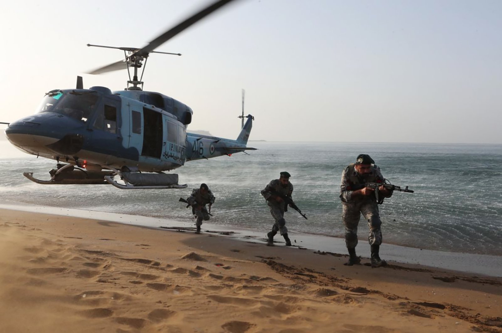 In this picture released by the Iranian Army, troops attend a maneuver in a coastal area in southeastern Iran, Nov. 7, 2021. (Iranian Army via AP)