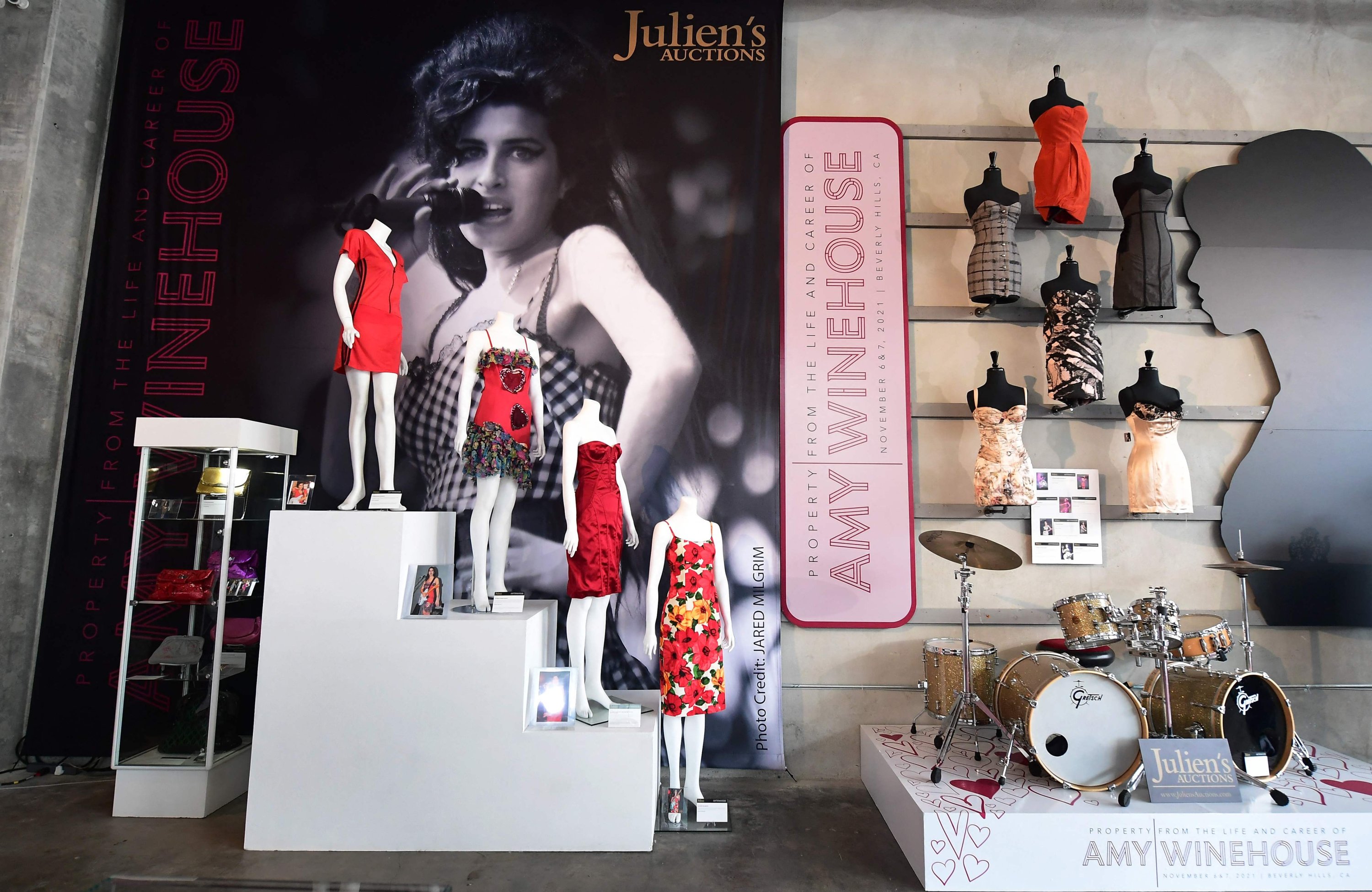A collection of Amy Winehouse's dresses and her drum set are displayed at Julien's Auctions in Beverly Hills, California, U.S., Nov. 1, 2021, ahead of the 'Property from the Life and Career of Amy Winehouse' auction held Nov. 6-7, 2021. (AFP Photo)
