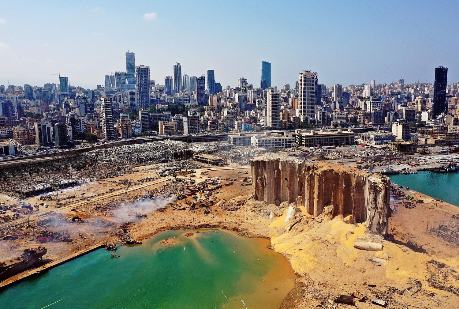 An aerial view shows the massive damage at Beirut port's grain silos (C) and the area around it on Aug. 5, 2020, one day after a massive explosion hit the harbor in the heart of the Lebanese capital. (AFP Photo)