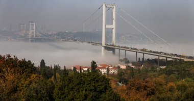 The 15 July Martyrs Bridge, formerly known as the Bosporus Bridge, which links the city's European and Asian sides, is pictured as fog covers the Bosporus in Istanbul, Turkey, Nov. 6, 2021. (Reuters Photo)