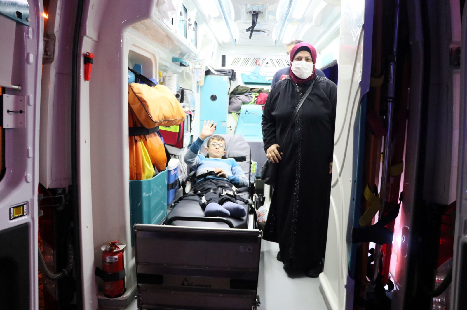 Mohammed Jamil Shahabi and his mother, Umm Mohammed Shahabi, wait in an ambulance before being airlifted to Istanbul, in Samsun, northern Turkey, Nov. 8, 2021. (AA PHOTO)