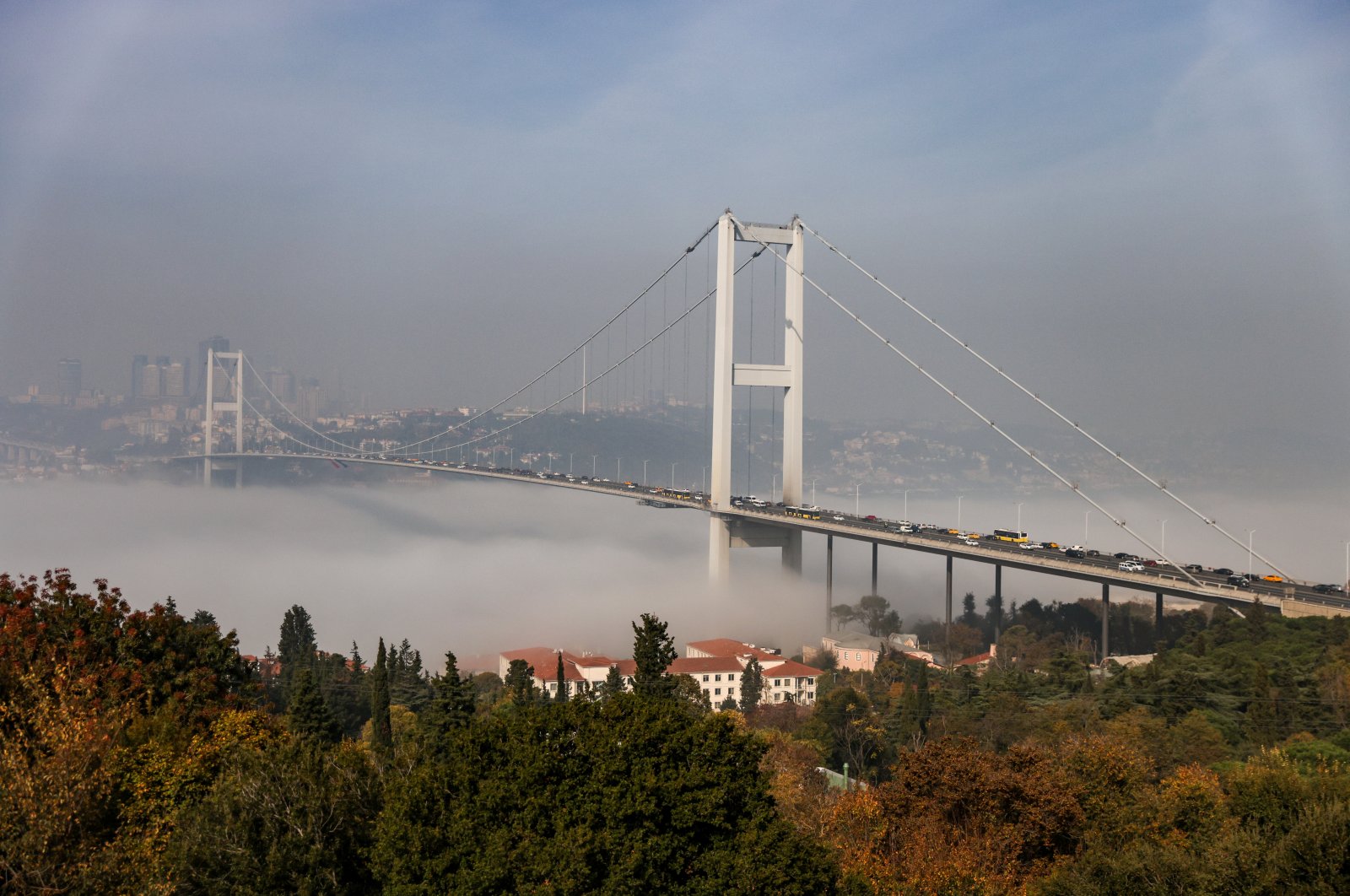 The 15 July Martyrs Bridge, formerly known as the Bosporus Bridge, which links the city's European and Asian sides, is pictured as fog covers the Bosporus in Istanbul, Turkey, Nov. 6, 2021. (Reuters Photo)