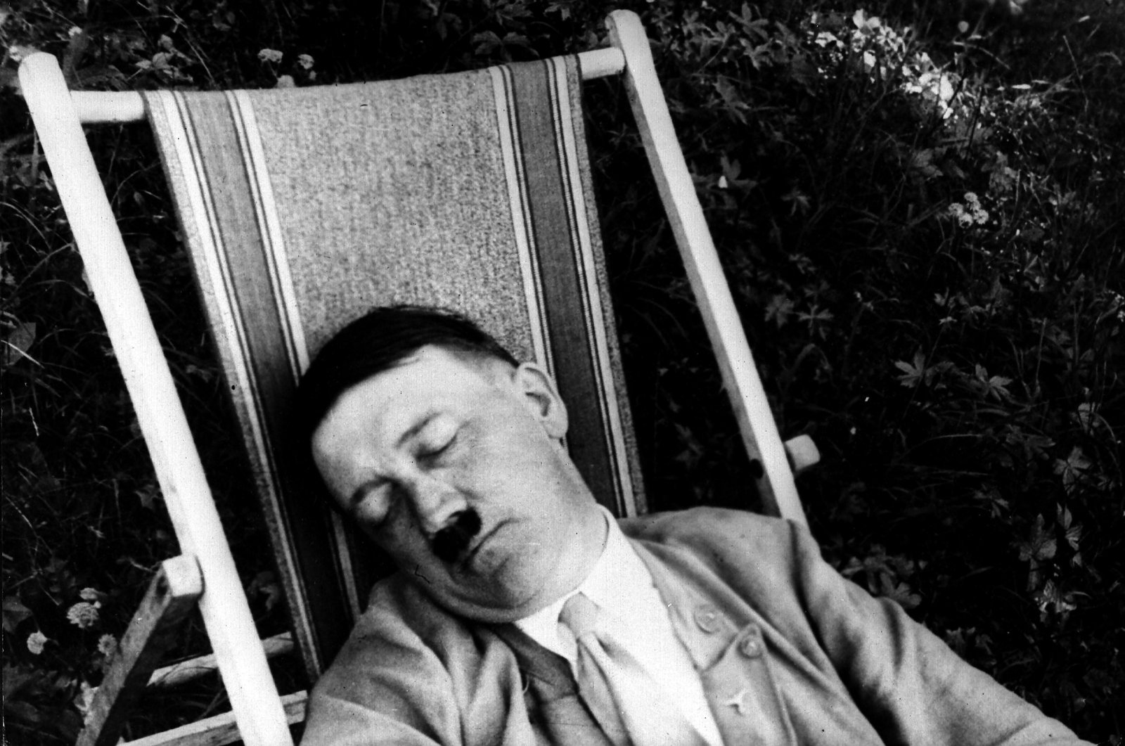 Adolf Hitler photographed during an afternoon nap in a deck chair in Bavaria around 1930. (Getty Images) 