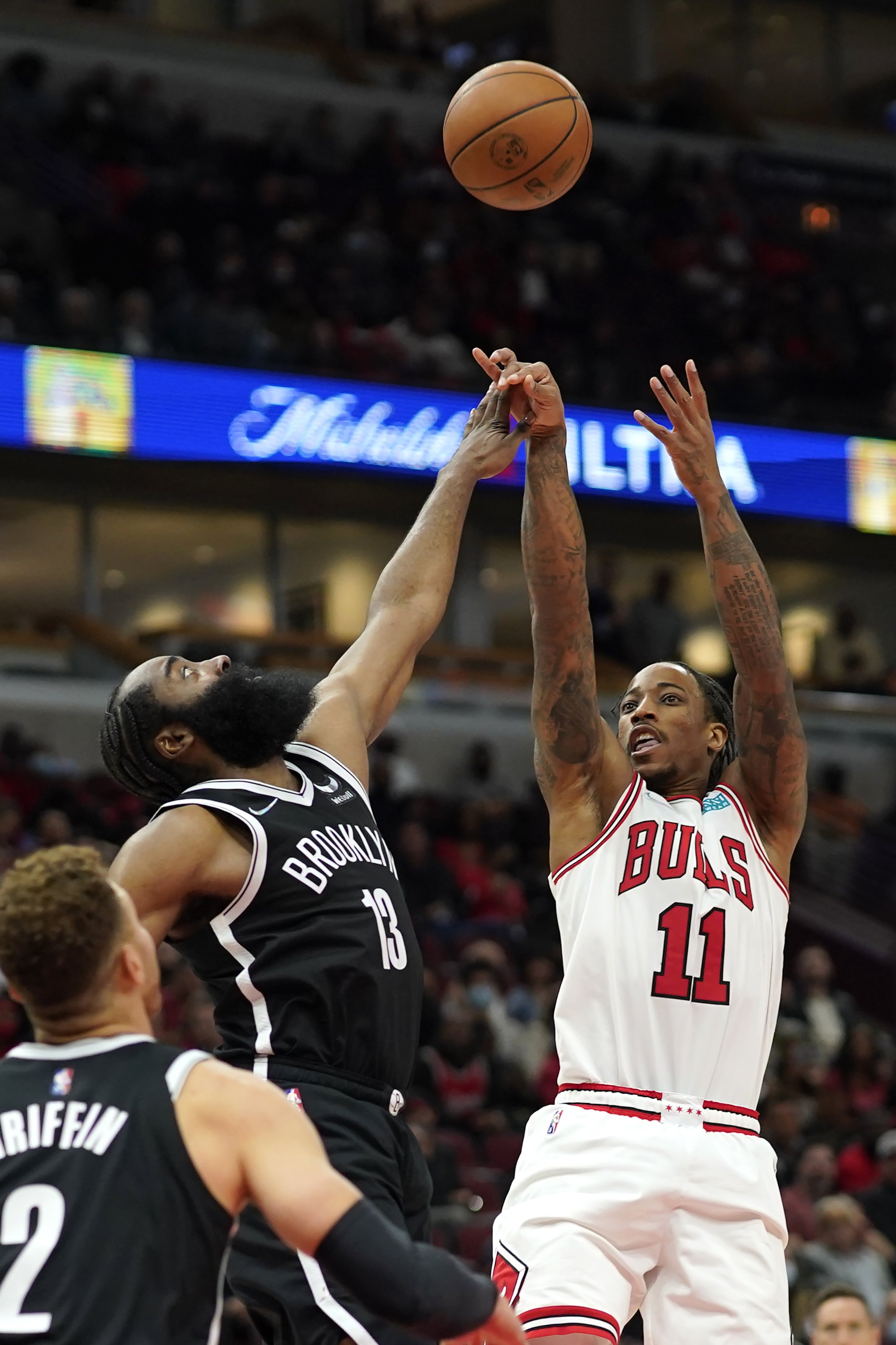 Chicago Bulls' DeMar DeRozan (R) shoots over Brooklyn Nets' James Harden during an NBA game in Chicago, U.S., Nov. 8, 2021. (AP Photo)