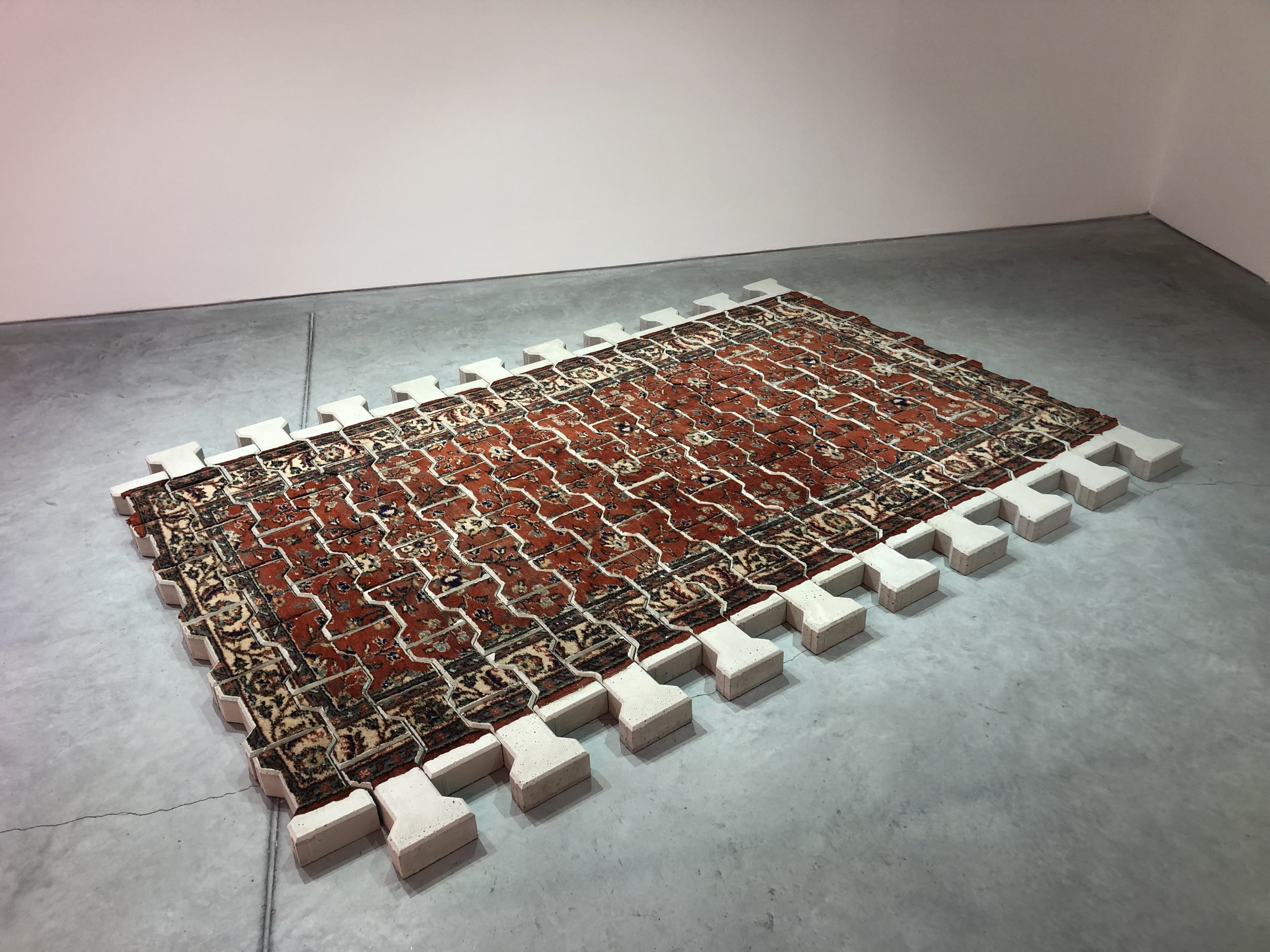 'The Pain of Existence' by Ramazan Can, 2021, concrete, rug. (Photo by Matt Hanson)
