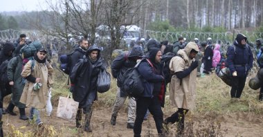 Migrants from the Middle East and elsewhere gather at the Belarus-Poland border near Grodno, Belarus, Nov. 8, 2021. (AP Photo)