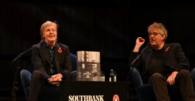 Paul McCartney is seen on stage at the Southbank's Royal Festival Hall in conversation with Paul Muldoon (editor) and Samira Ahmed (unseen) in London, Britain, Nov. 5, 2021. (Reuters Photo)