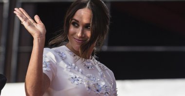 Meghan Markle, Duchess of Sussex, salutes during the Global Citizen festival, in New York, U.S., Sept. 25, 2021. (AP Photo)