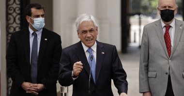 Chilean President Sebastian Pinera (R), with his ministers Rodrigo Delgado (L), Interior and Security, and Baldo Prokurica (C) Defense, attends a press conference at the Palacio de la Moneda, in Santiago, Chile, Nov. 04, 2021. (EPA Photo)