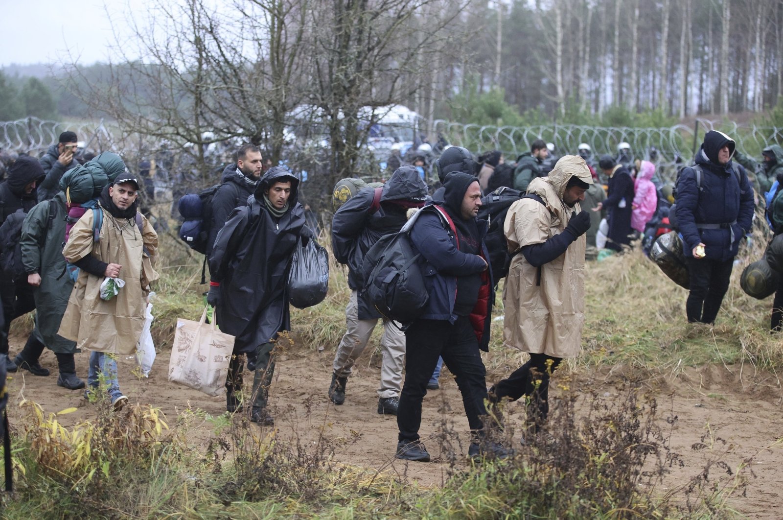 Migrants from the Middle East and elsewhere gather at the Belarus-Poland border near Grodno, Belarus, Nov. 8, 2021. (AP Photo)