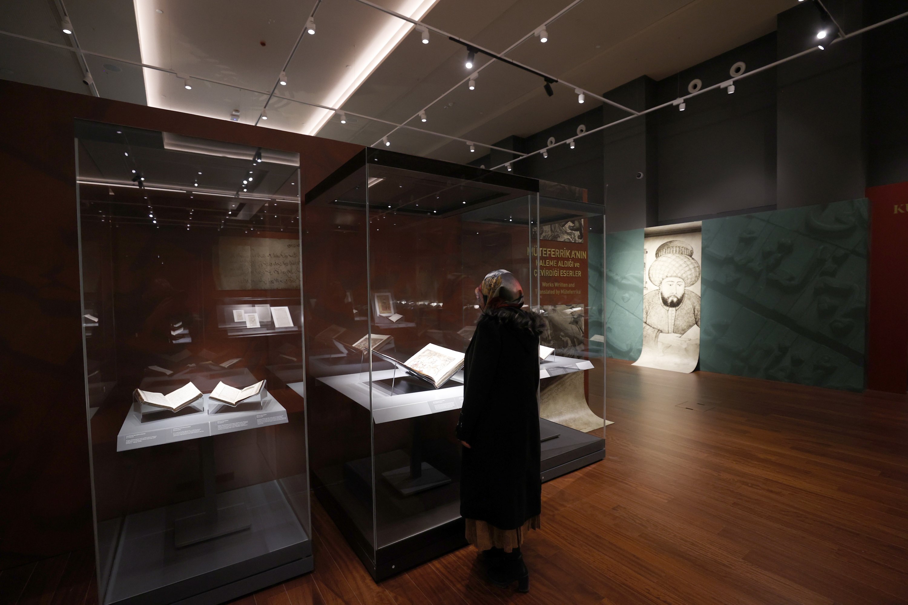 A visitor examines the “Foreword to the Printing House: Basmacı Ibrahim Efendi Müteferrika” exhibition, at the Presidential Library, Ankara, Turkey, Nov. 9, 2021. (AA Photo)